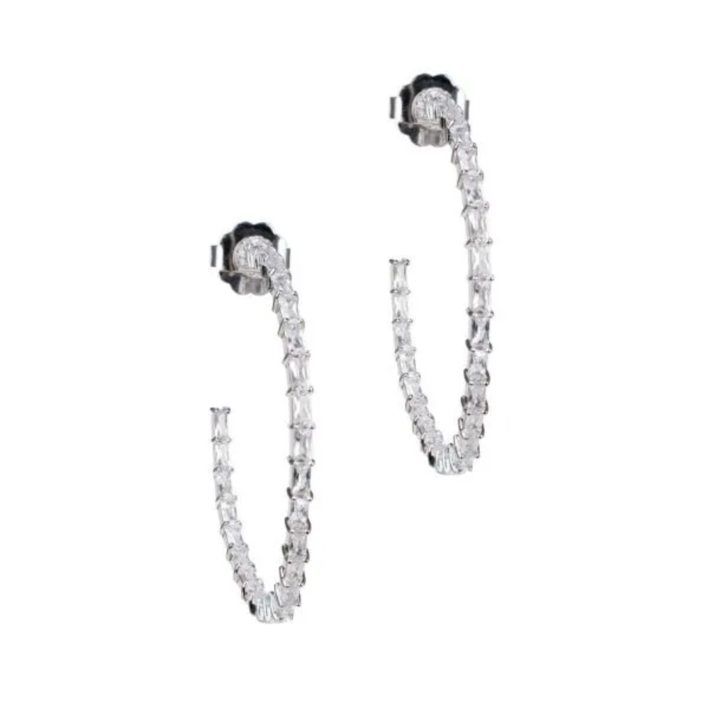 12 CTTW baguette cubic zirconia inside-out hoop earrings. Post ear set in rhodium-plated brass.