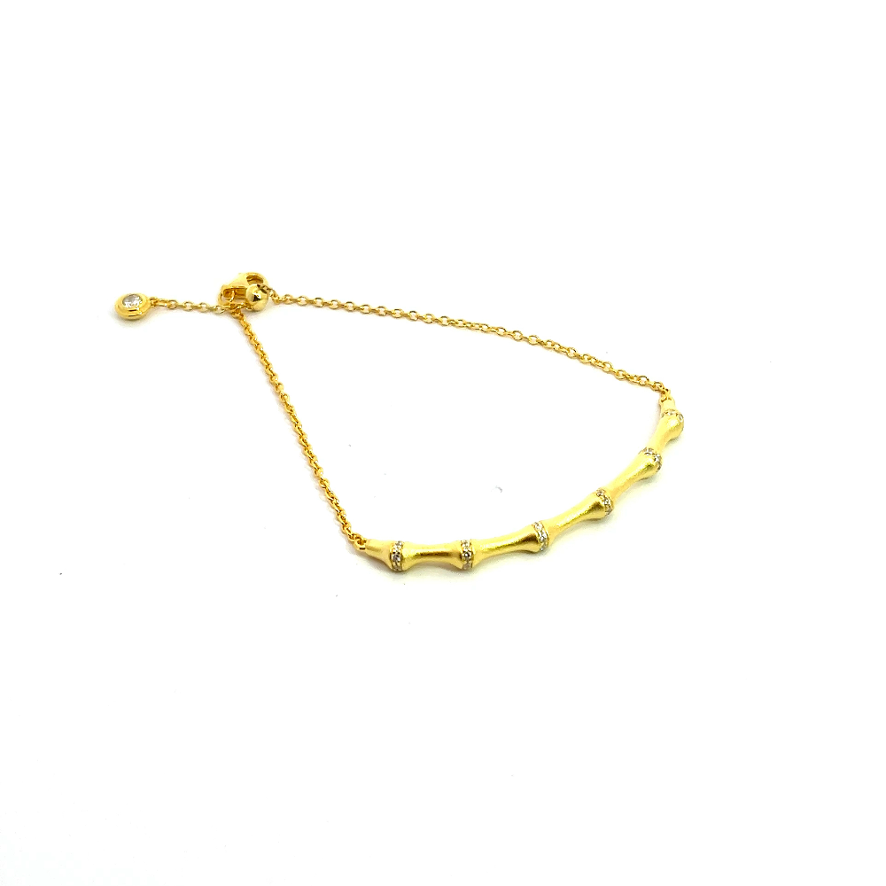 Sterling silver 18k gold-dipped bamboo bracelet with cubic zirconia accents for a sleek contemporary style. Shop premium jewelry online.