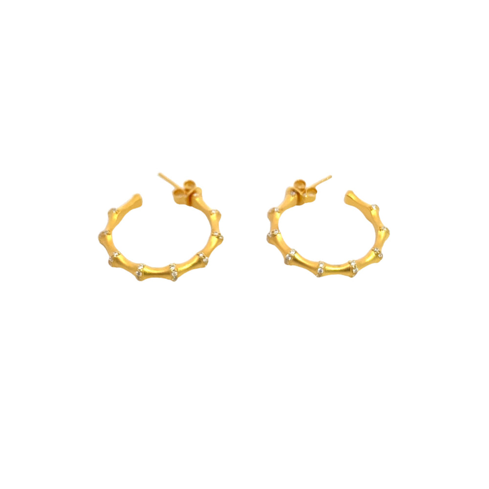 Shop online premium 18K gold bamboo hoop earrings with sparkling cubic zirconia stones.
