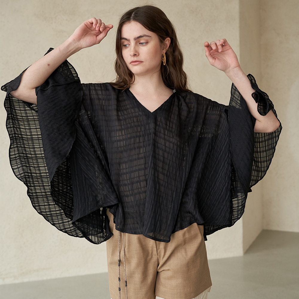 Find elegant bead-embellished cape sleeve blouses at luxury shops online. Shop Now!