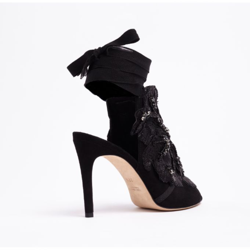 A gorgeous open-toe mule. Made in Italy from smooth black suede, La Jolie is enhanced by a handmade embroidered flower.