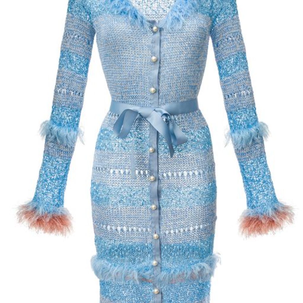 Blue Knit Cardigan-Dress With Pearl Buttons is spun from a soft silk blend.