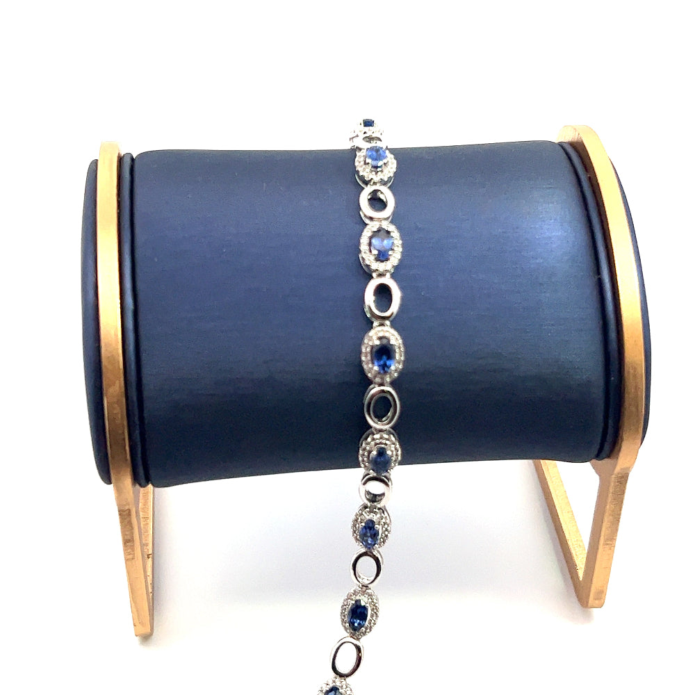 Sterling silver rhodium plated bracelet with lab-created blue sapphires and sparkling cubic zirconia for a sleek timeless statement. Shop premium jewelry online.