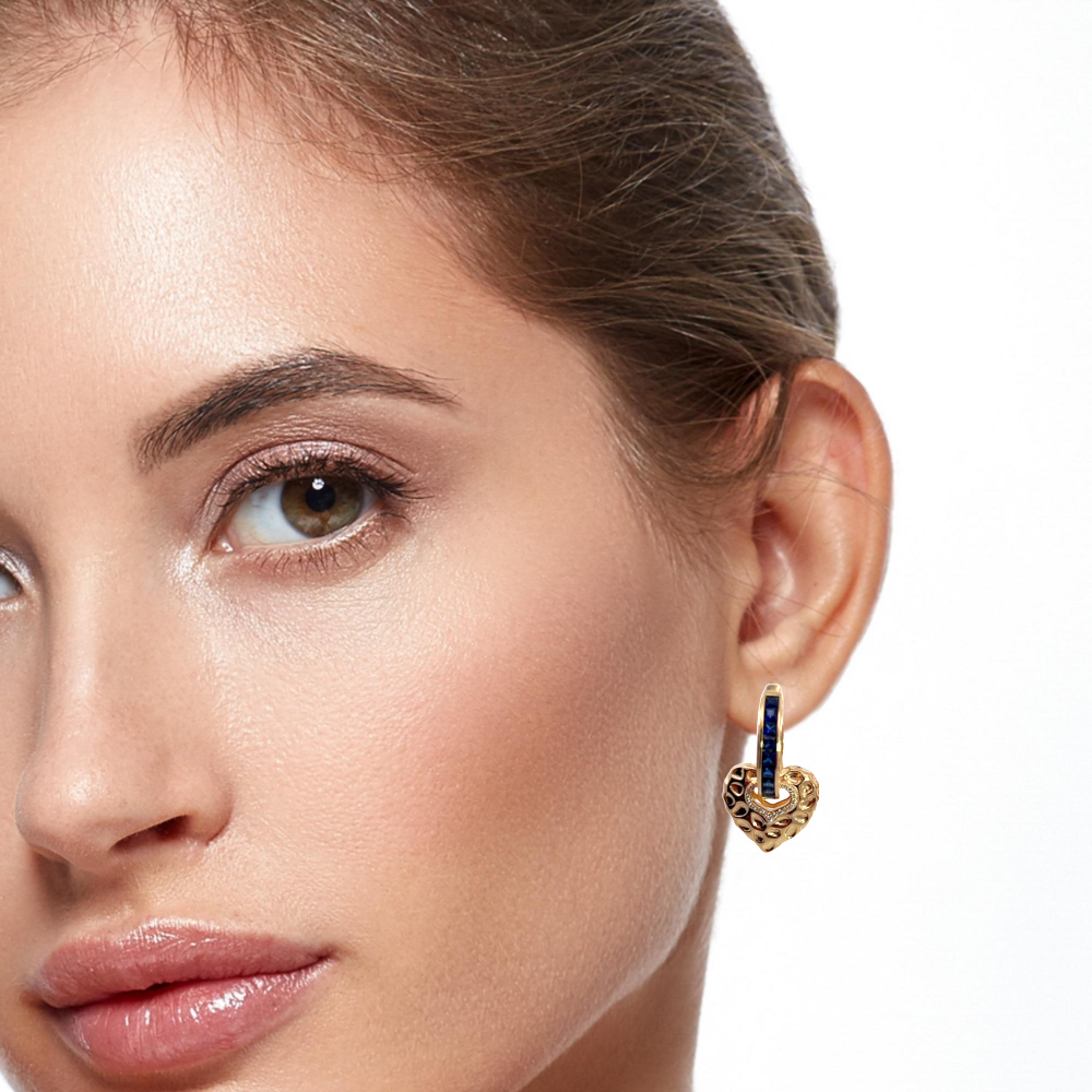 Shop online premium gold-dipped blue sapphire huggie earrings with heart-shaped drops.