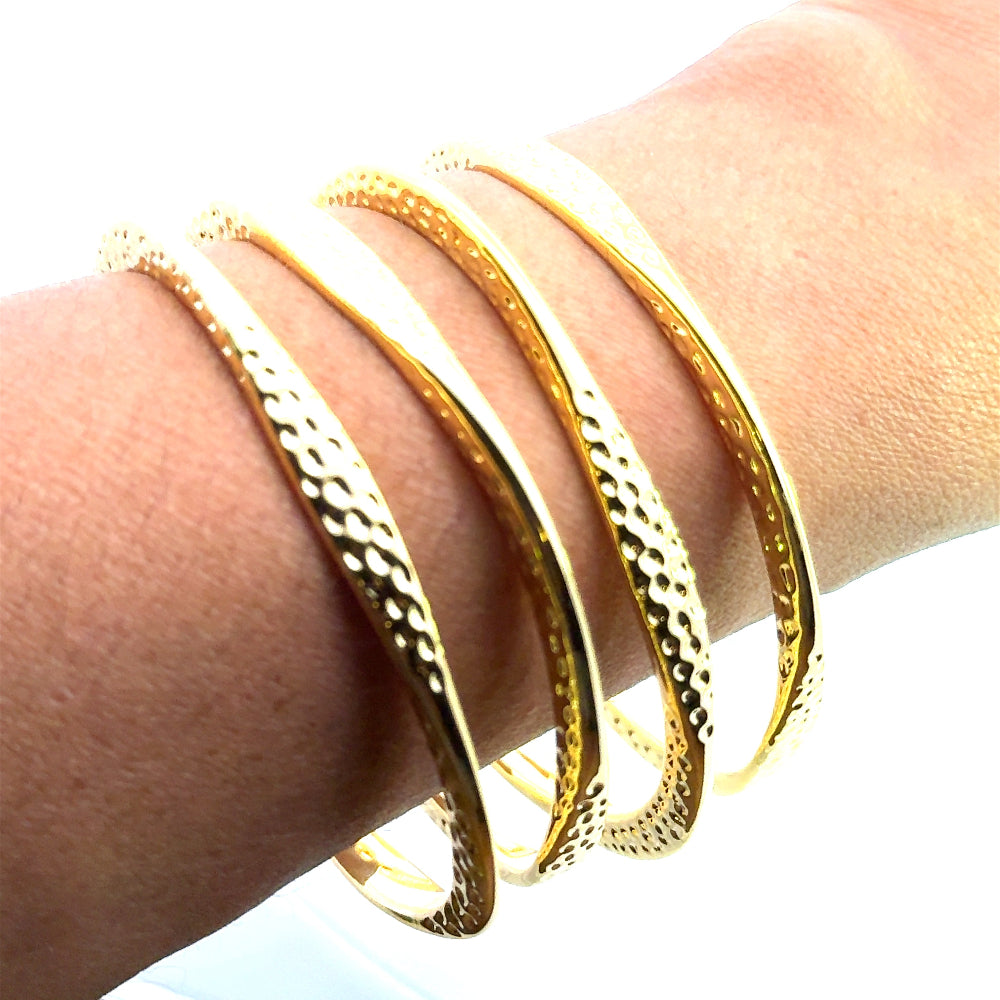 Handmade 22K yellow gold plated hammered bangle with a sleek narrow design. Perfect for stacking or solo styling. Shop premium jewelry online.
