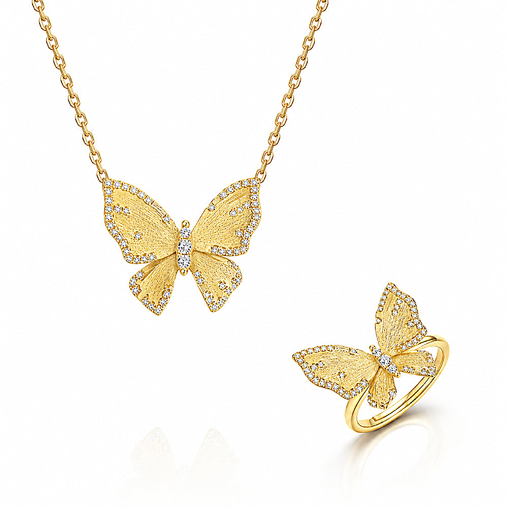 Discover the Butterfly Reverie Gold Vermeil Necklace and Ring Jewelry Set at The Luxe Maison, featuring delicate butterfly designs crafted in 18K gold vermeil over S925 sterling silver. Finished with a hand-brushed satin texture and sparkling zircon accents, this elegant duo captures the beauty of golden wings with a soft, luminous glow. Wear the necklace and ring together for a coordinated look or separately for a touch of whimsical charm and timeless elegance.
