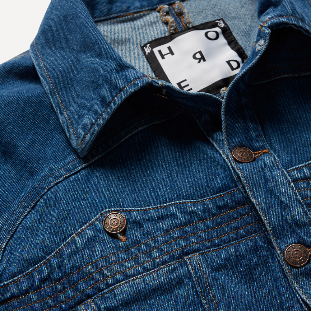 Dark blue 100% cotton organic stonewashed paneled denim jacket cut for a boxy fit. 