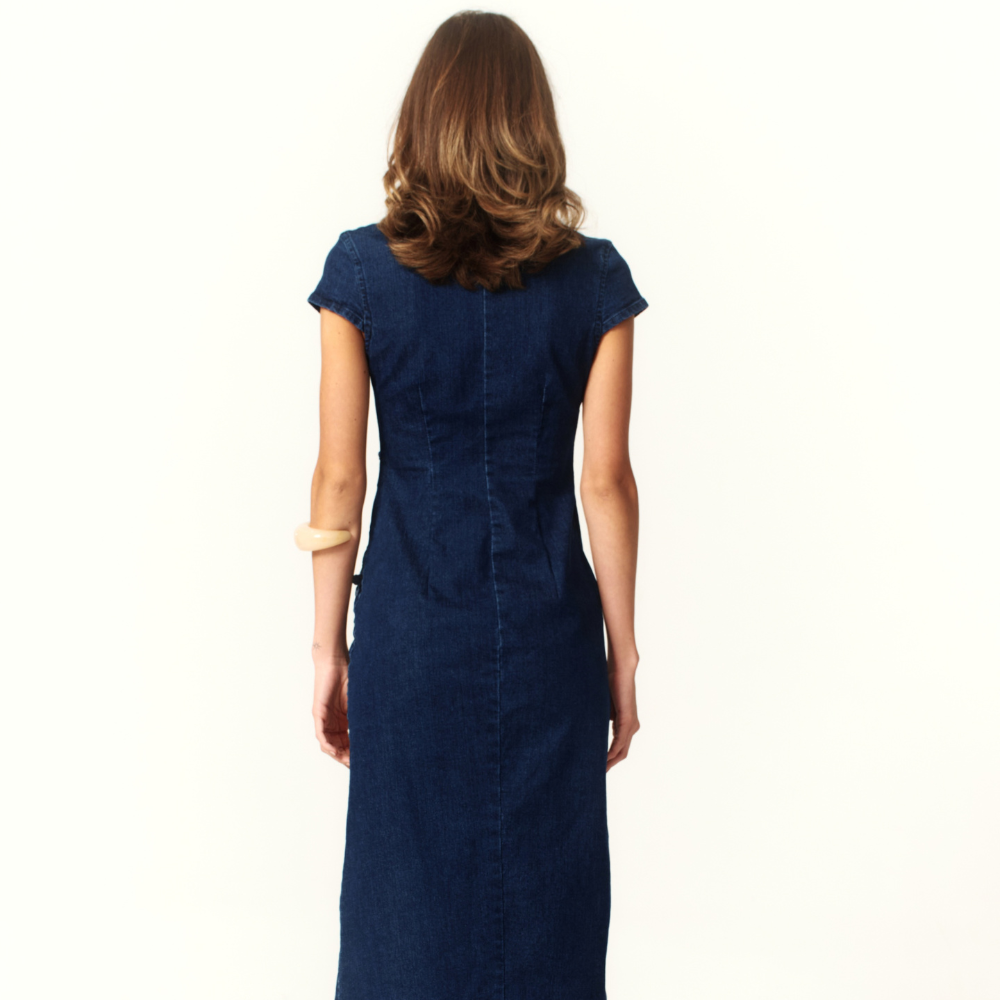 Shop the Camille Denim Midi Dress at TLM, featuring a tailored fit, high neckline and front slit. Explore luxury fashion on The Luxe Maison website.