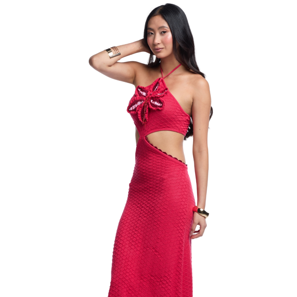 Shop the Carla Red Maxi Dress at TLM, featuring a crochet flower halter neckline, beaded details and waist cut-outs. Explore luxury fashion on The Luxe Maison website.
