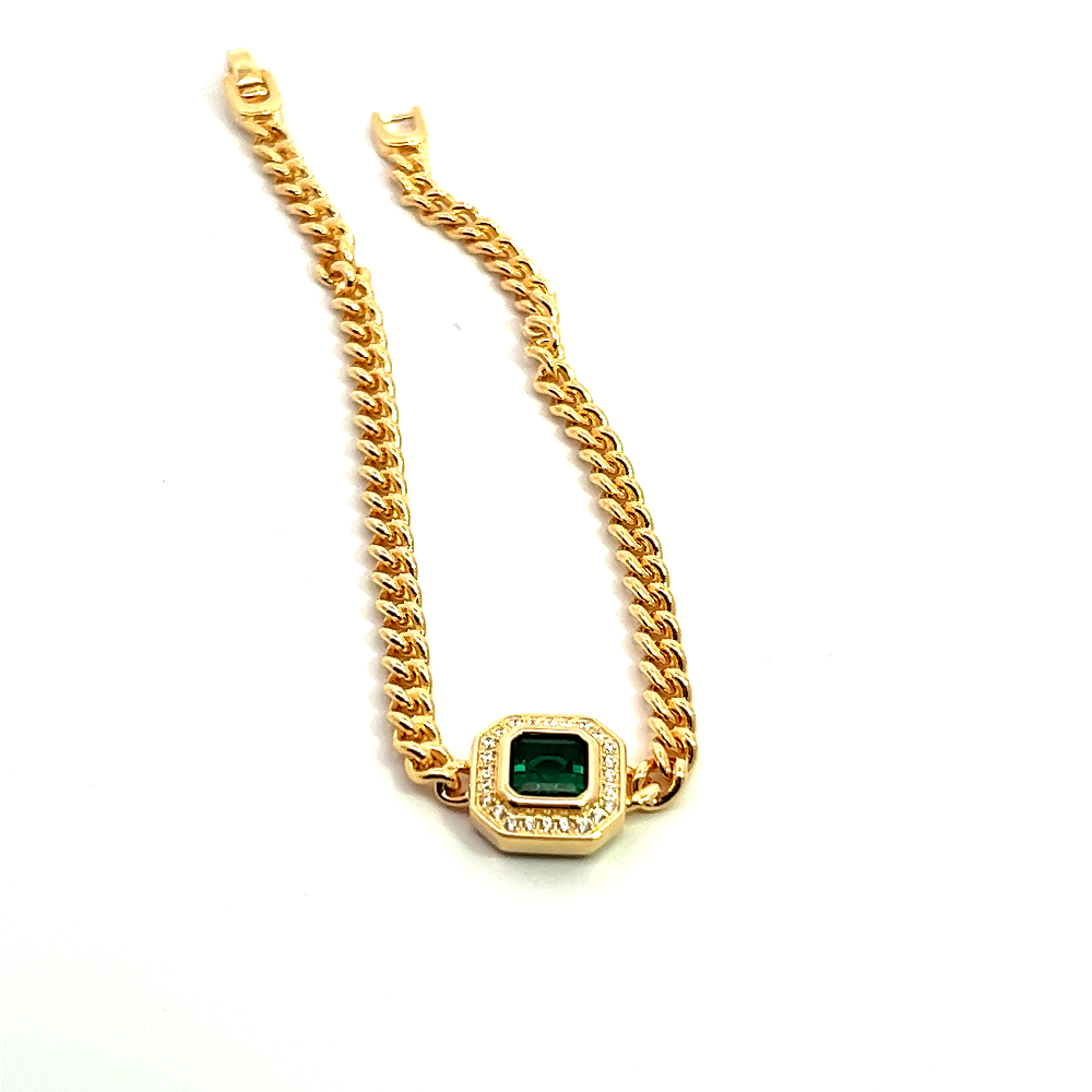 Sterling silver 18k gold-dipped bracelet with a lab-created emerald centerpiece surrounded by sparkling cubic zirconia accents for a refined modern style. Shop premium jewelry online.