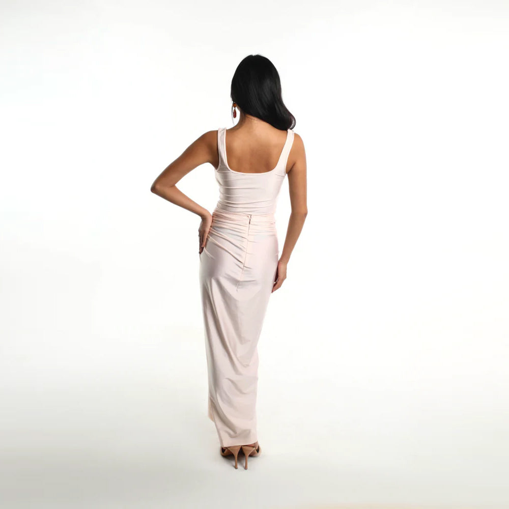 Blush slip dress with ruched drape and side knot, perfect for brunch and events. Shop online from our curated edit of premium fashion.