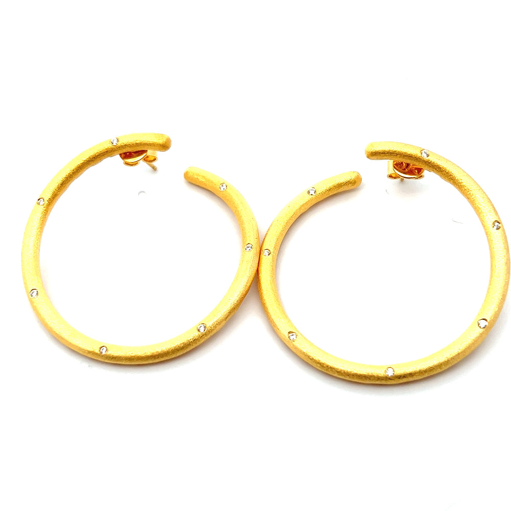 Shop online premium 18K gold-dipped hoop earrings with sparkling cubic zirconia stones.