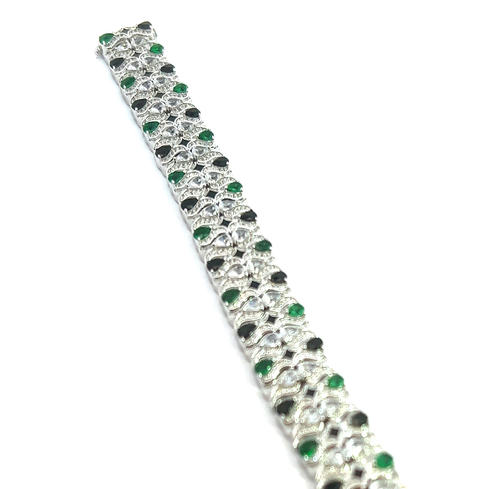 Victorian-style sterling silver bracelet featuring lab-created emeralds, blue sapphires, and sparkling cubic zirconia for a bold timeless statement. Shop premium jewelry online.