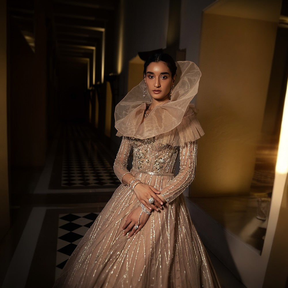 Scintillating Cosmos depicted through Signature embroideries over double circular skirt ball gown with imperial train.