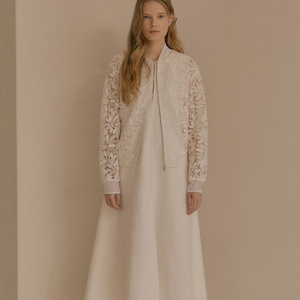 Raw-edged, Round neckline One side handkerchief-hem with patch pocket Adjustable tie belt at waist Relaxed silhouette.