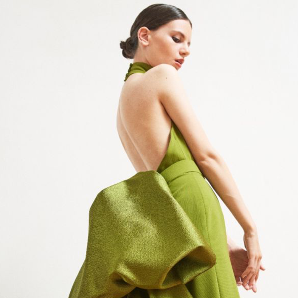 Explore the wonderful Cornelia gown dress in our women clothing shop with detachable train in tussord and halter neckline in olive green. Shop now!