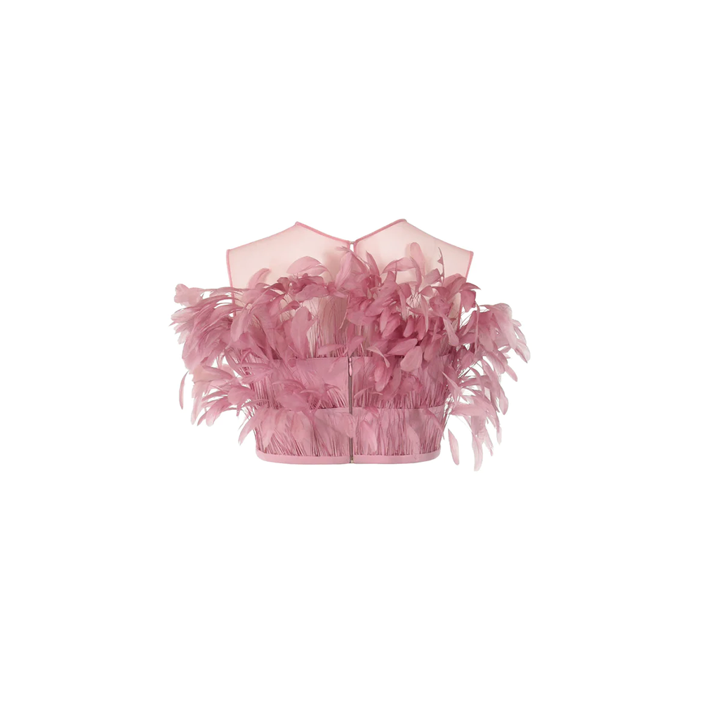 A cotton candy pink feathered cropped top, with crepe bell bottom trousers.