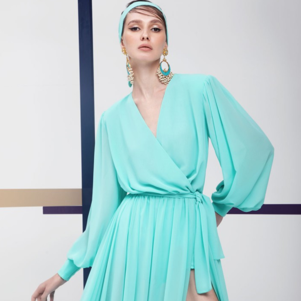 This gown is floor length, pastel green color, long puff sleeves party wear.