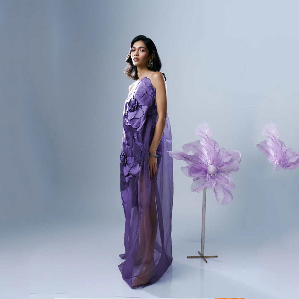 Lavender strapless organza gown with floral appliqué and 3D flowers, perfect for events. Shop online from our exclusive collection of premium styles.