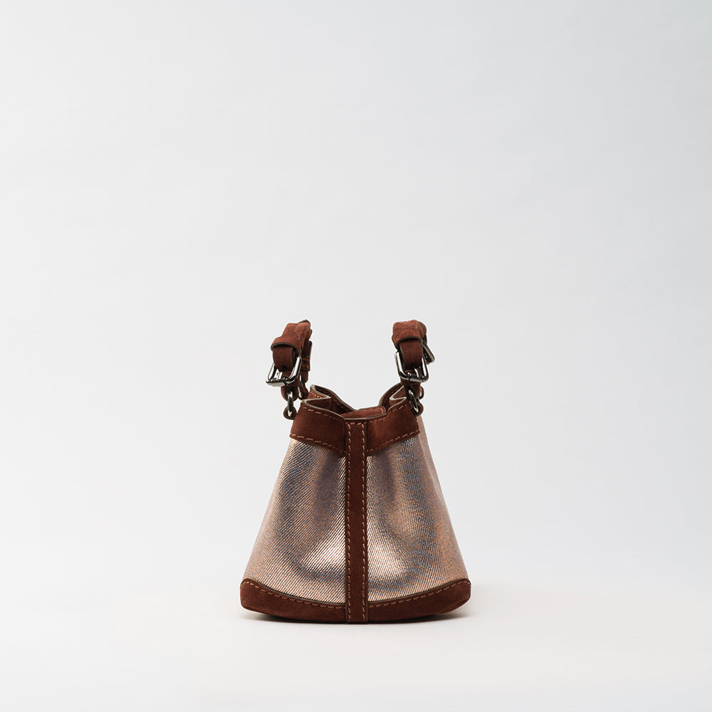 The Luxe Maison's Cubo Luthien Copper Denim is now available at women’s online shop! Get this chic, versatile handbag to complete your look. Shop Now!