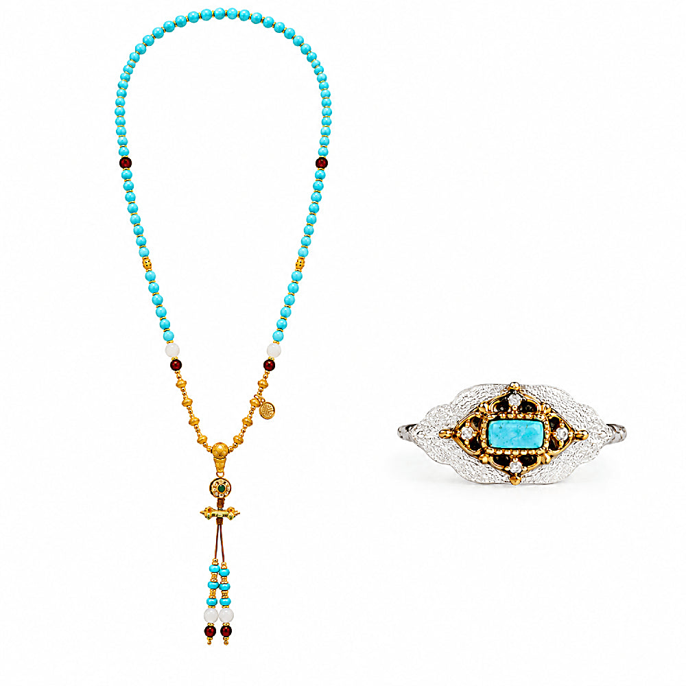 Discover the Dakini Turquoise Necklace & Ring Jewelry Set at The Luxe Maison, featuring vibrant turquoise beads, carnelian accents, a sacred vajra pendant, and a matching turquoise ring in champagne gold vermeil for a spiritual, elegant look.