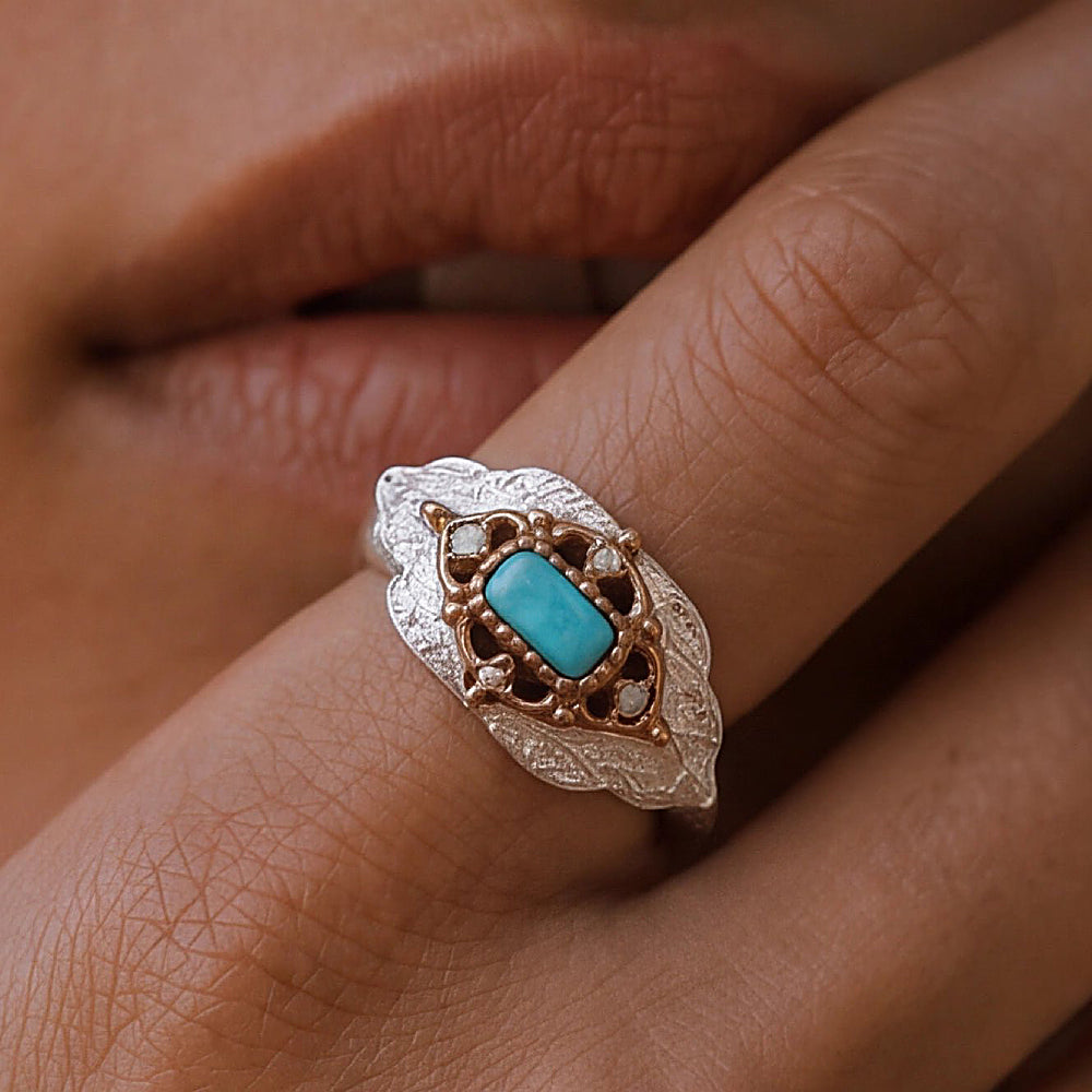 Discover the Dakini Turquoise & Sterling Silver Ring at The Luxe Maison, featuring a vivid natural turquoise centerpiece framed by textured sterling silver and warm 14K gold vermeil accents. Inspired by the Himalayan sky dancer, this distinctive ring blends nature-inspired detailing with timeless elegance and a touch of bohemian charm.