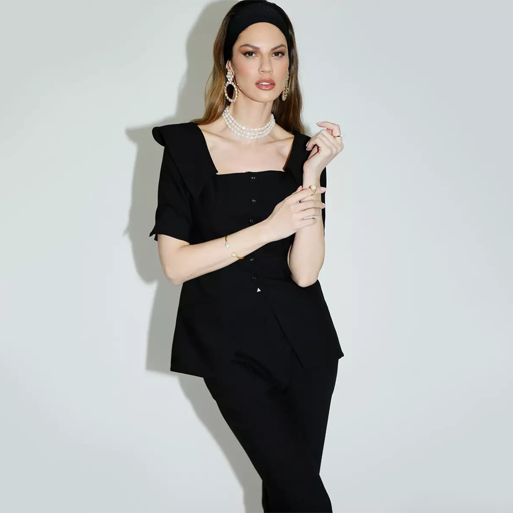 The black Danieli top is made with viscose, polyester, and elastane.