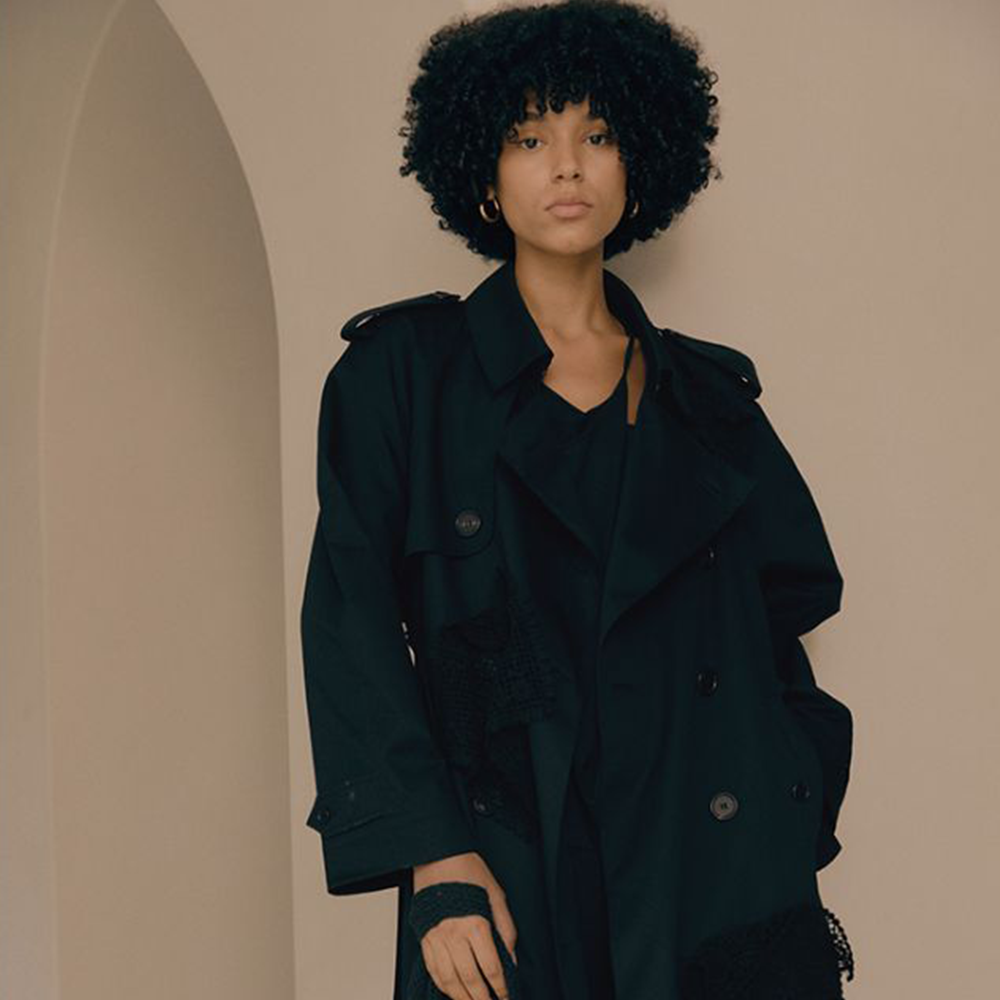 Raw-edged, Round neckline One side handkerchief-hem with patch pocket Adjustable tie belt at waist Relaxed silhouette.