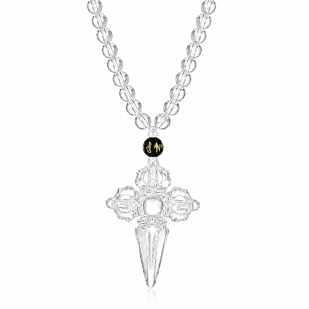 Discover the Double Vajra & Phurba Crystal Necklace at The Luxe Maison, featuring a luminous clear crystal pendant and a Tibetan mantra bead inscribed with Om Mani Padme Hum for a spiritual, meaningful touch.