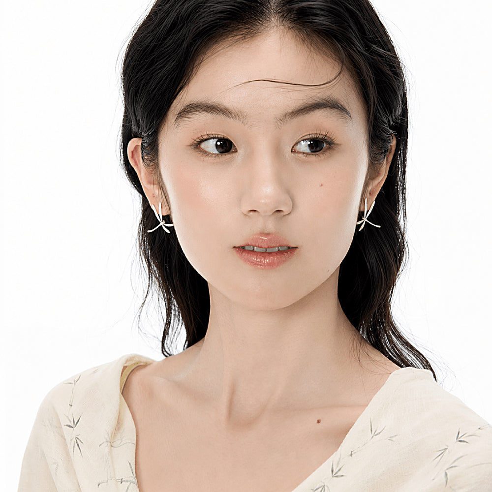 Discover the Dragonfly Whisper Silver Earrings at The Luxe Maison, featuring delicate wing-inspired lines and a graceful, minimalist design that captures the beauty of a dragonfly in flight. Perfect for adding a subtle, nature-inspired elegance to everyday outfits and special occasions.