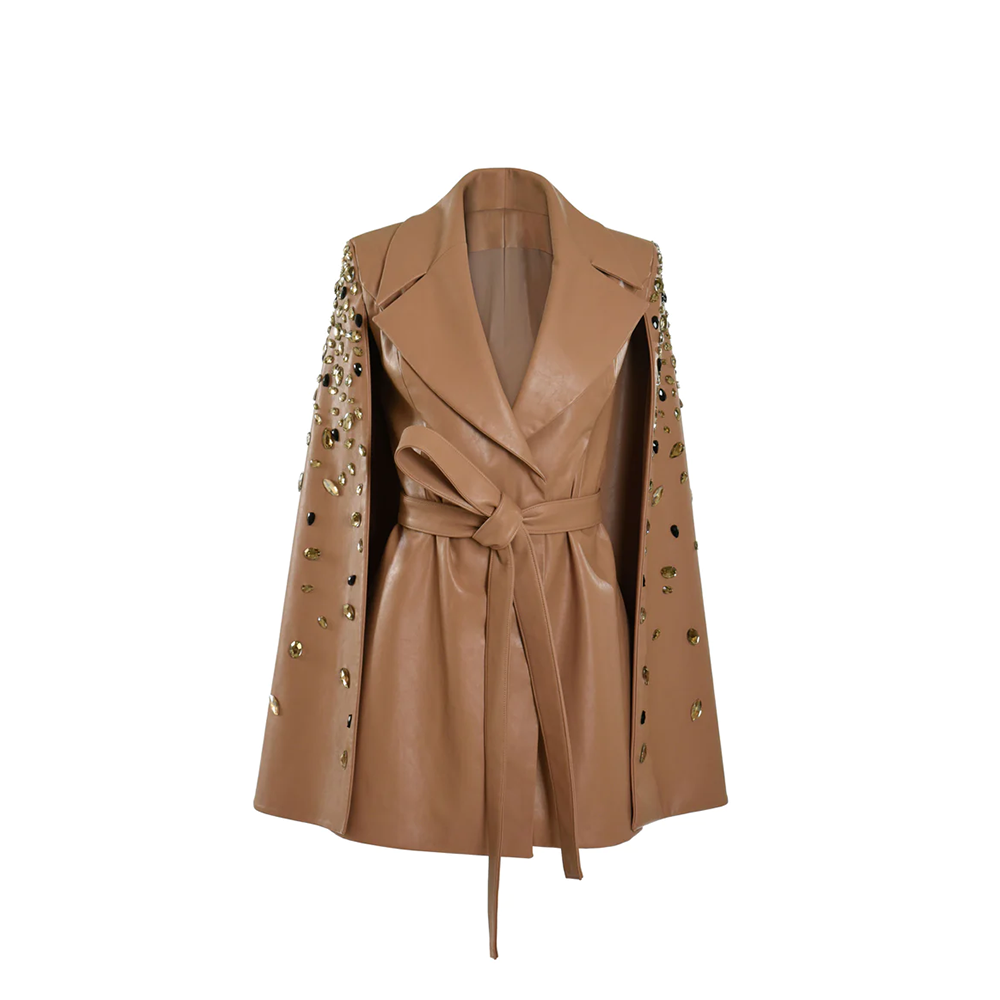 Beige cape coat with embroidered sleeves.