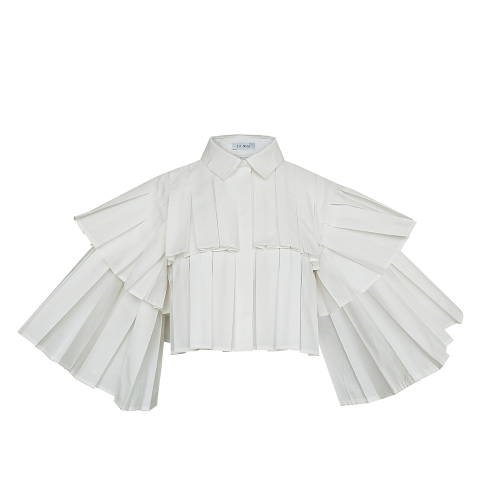 Shop Junna's Eva Organic Cotton Tiered Pleat Open Back Shirt. Perfect women’s clothing for eco-conscious shoppers. Shop now!