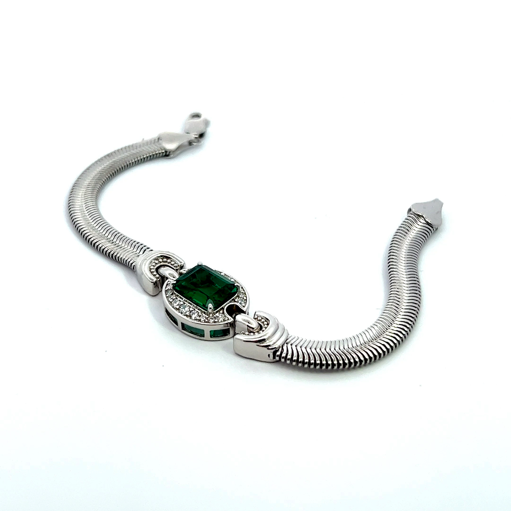 Sterling silver bracelet featuring a square lab-created emerald center stone framed with sparkling cubic zirconia accents for a bold modern look. Shop premium jewelry online.