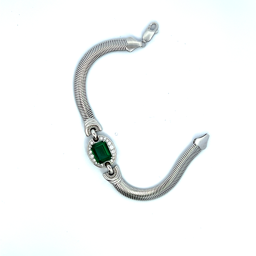 Sterling silver bracelet featuring a square lab-created emerald center stone framed with sparkling cubic zirconia accents for a bold modern look. Shop premium jewelry online.