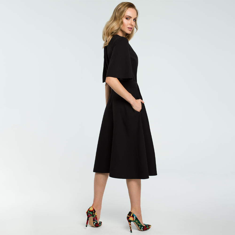 Woven fabric ; fit and flare cut with a side slit ; short bell sleeves and below knee length.