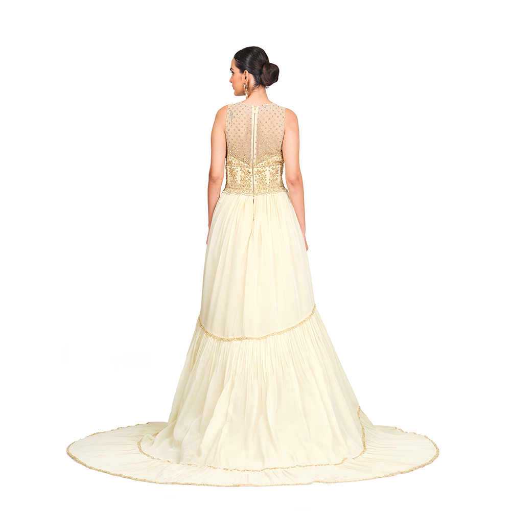 Cord-work and sequins on bodice l Gathered bottom l V neck l Floor sweeping trail l Centre back zip closure.