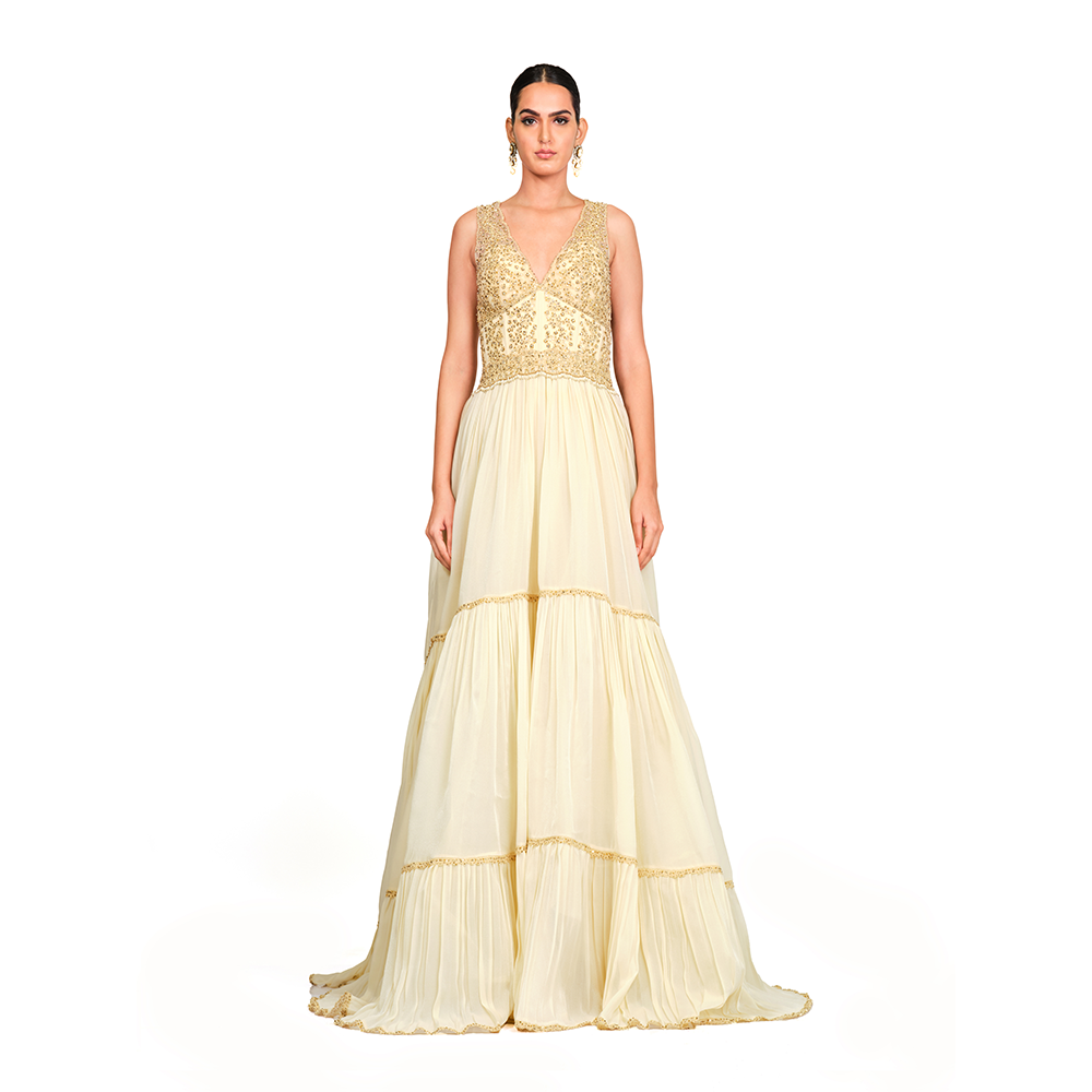 Cord-work and sequins on bodice l Gathered bottom l V neck l Floor sweeping trail l Centre back zip closure.