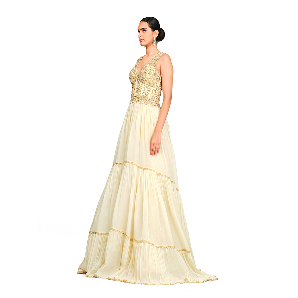 Cord-work and sequins on bodice l Gathered bottom l V neck l Floor sweeping trail l Centre back zip closure.