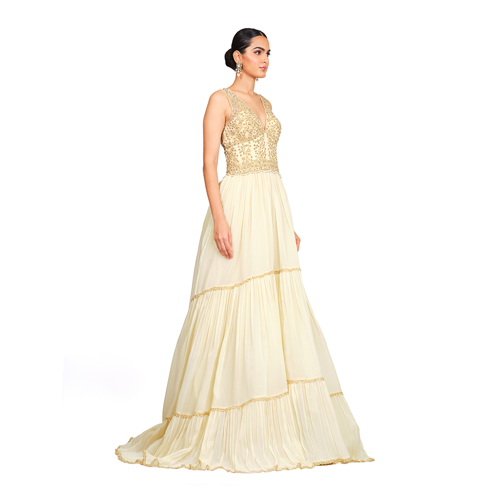 Cord-work and sequins on bodice l Gathered bottom l V neck l Floor sweeping trail l Centre back zip closure.