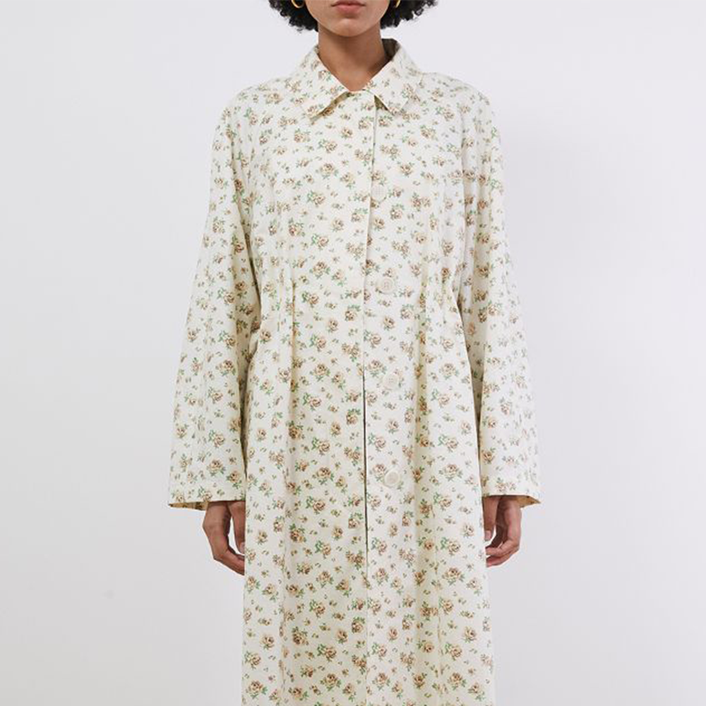 Raw-edged, Round neckline One side handkerchief-hem with patch pocket Adjustable tie belt at waist Relaxed silhouette.