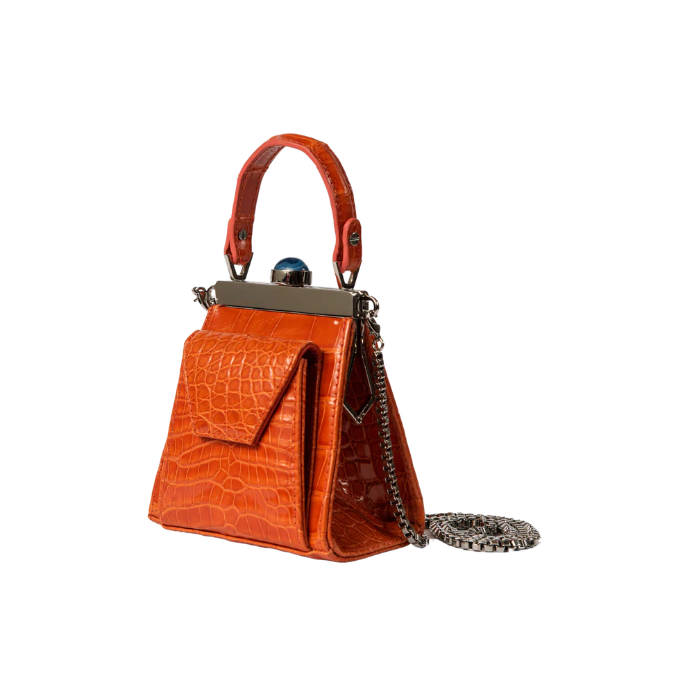 This playful mini bag fuses classic craftsmanship with creative kitsch. Quirky, classy and quintessentially cool.