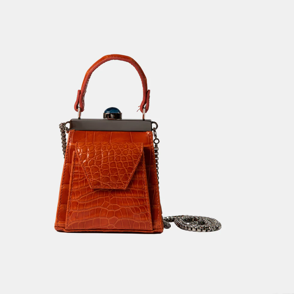 This playful mini bag fuses classic craftsmanship with creative kitsch. Quirky, classy and quintessentially cool.