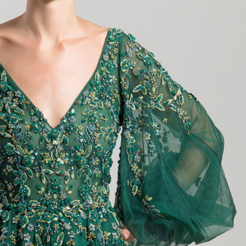 Opened chest, wide sleeves, full circle skirt tulle long dress. Fully beaded on top fading after the waist cut.