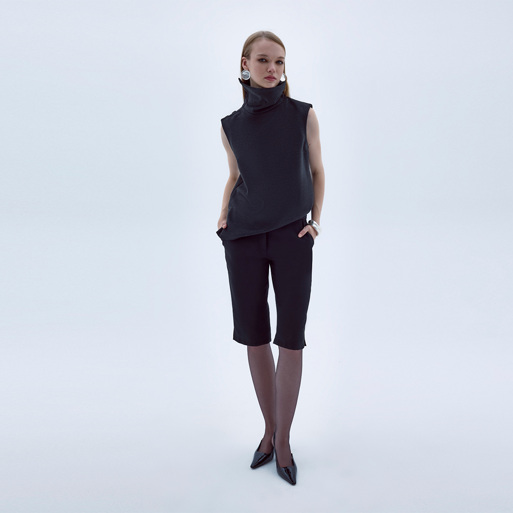 Geena Sleeveless Roll-Neck Top captures true luxury designer top beauty. Shop Now!