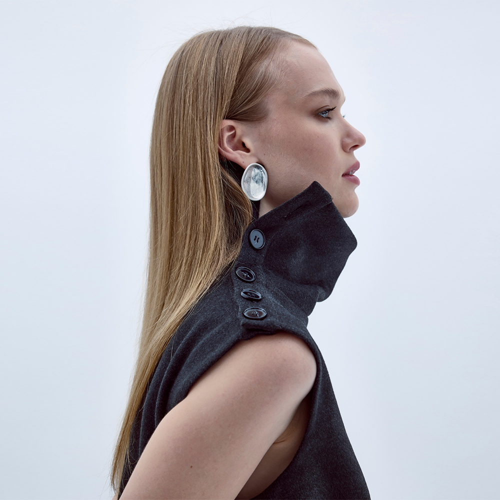 Geena Sleeveless Roll-Neck Top captures true luxury designer top beauty. Shop Now!