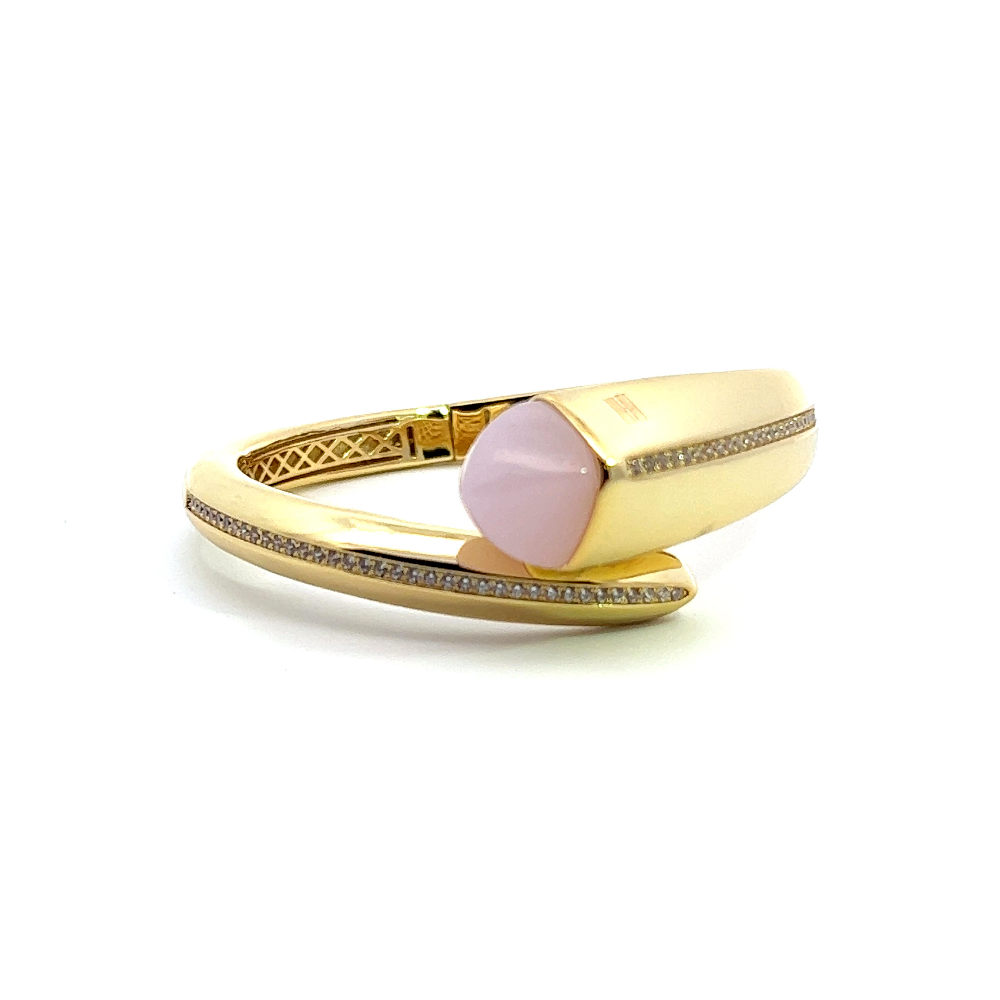 Elegant yellow gold plated cuff bracelet with a colored pyramidal crystal and sparkling pavé cubic zirconia accents. Perfect for luxe everyday styling. Shop premium jewelry online.