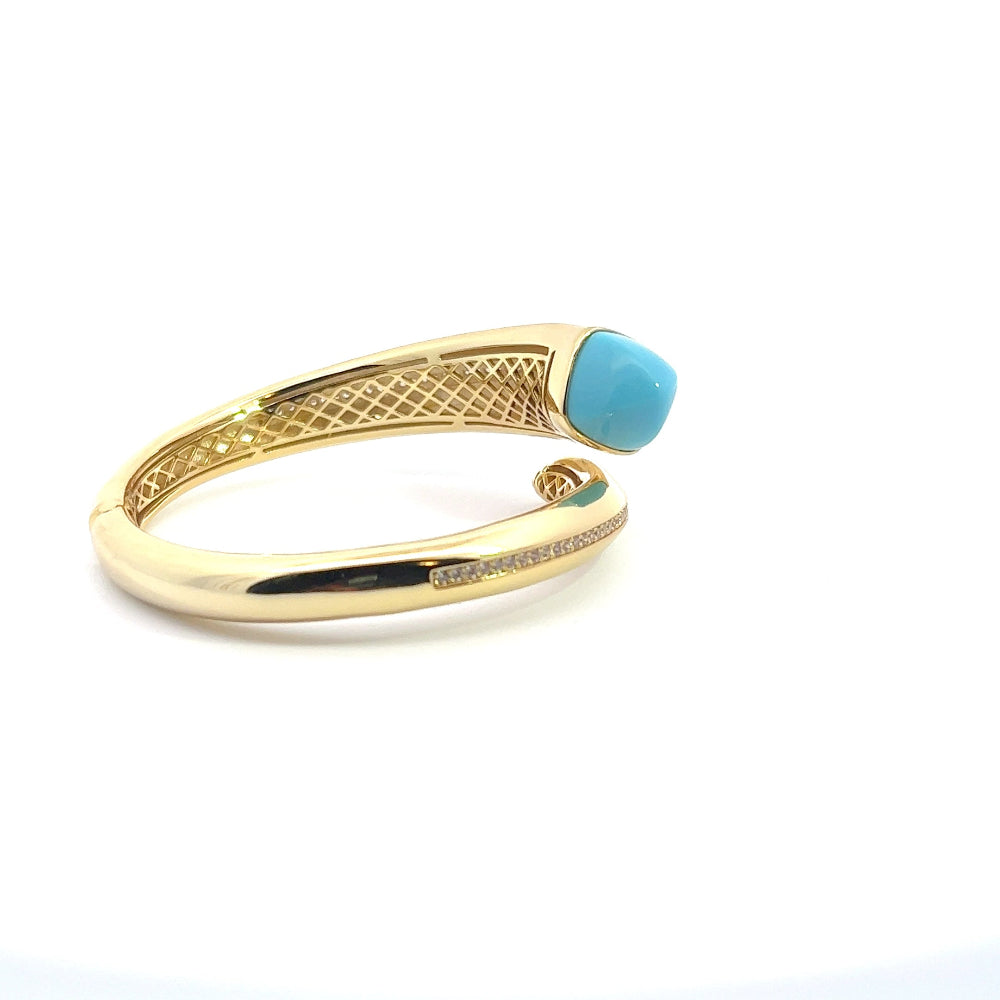 Elegant yellow gold plated cuff bracelet with a colored pyramidal crystal and sparkling pavé cubic zirconia accents. Perfect for luxe everyday styling. Shop premium jewelry online.