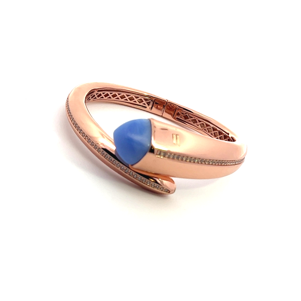 Elegant rose gold plated cuff bracelet with a colored pyramidal crystal and sparkling pavé cubic zirconia accents. Shop premium jewelry online.