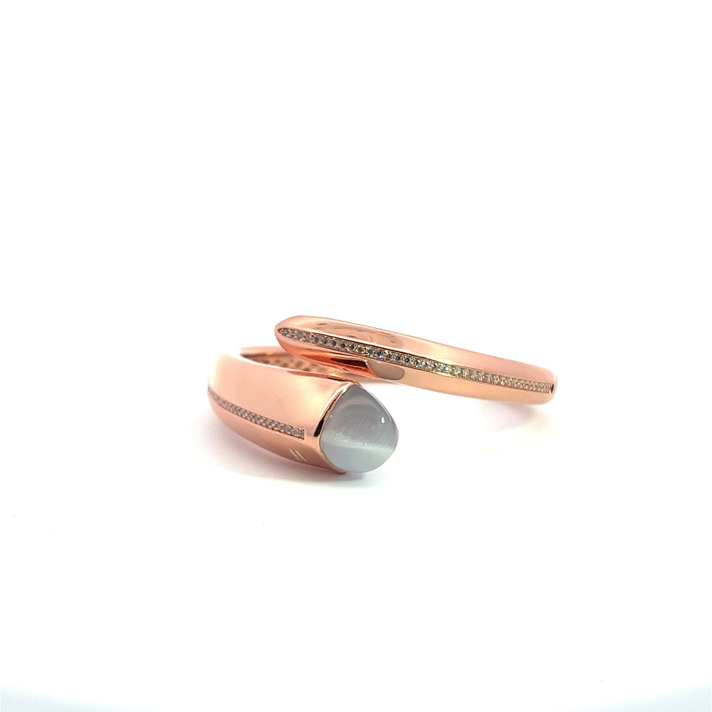 Elegant rose gold plated cuff bracelet with a colored pyramidal crystal and sparkling pavé cubic zirconia accents. Shop premium jewelry online.