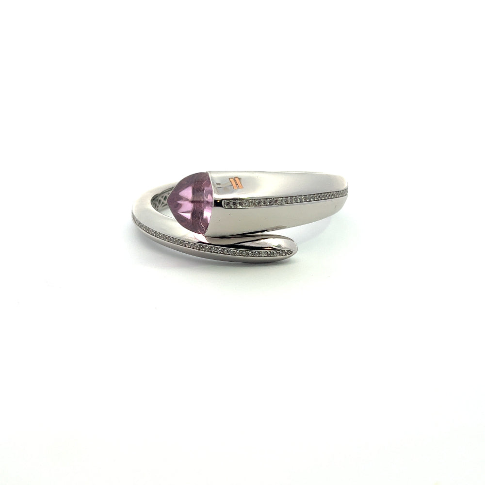 Elegant rhodium plated cuff bracelet with a colored pyramidal crystal and sparkling pavé cubic zirconia accents. A chic luxe accessory for every occasion. Shop premium jewelry online.